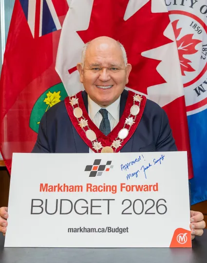 Mayor Frank Scarpitti displays a signed Budget 2026 sign at the Markham Civic Centre on Oct. 31, 2025.